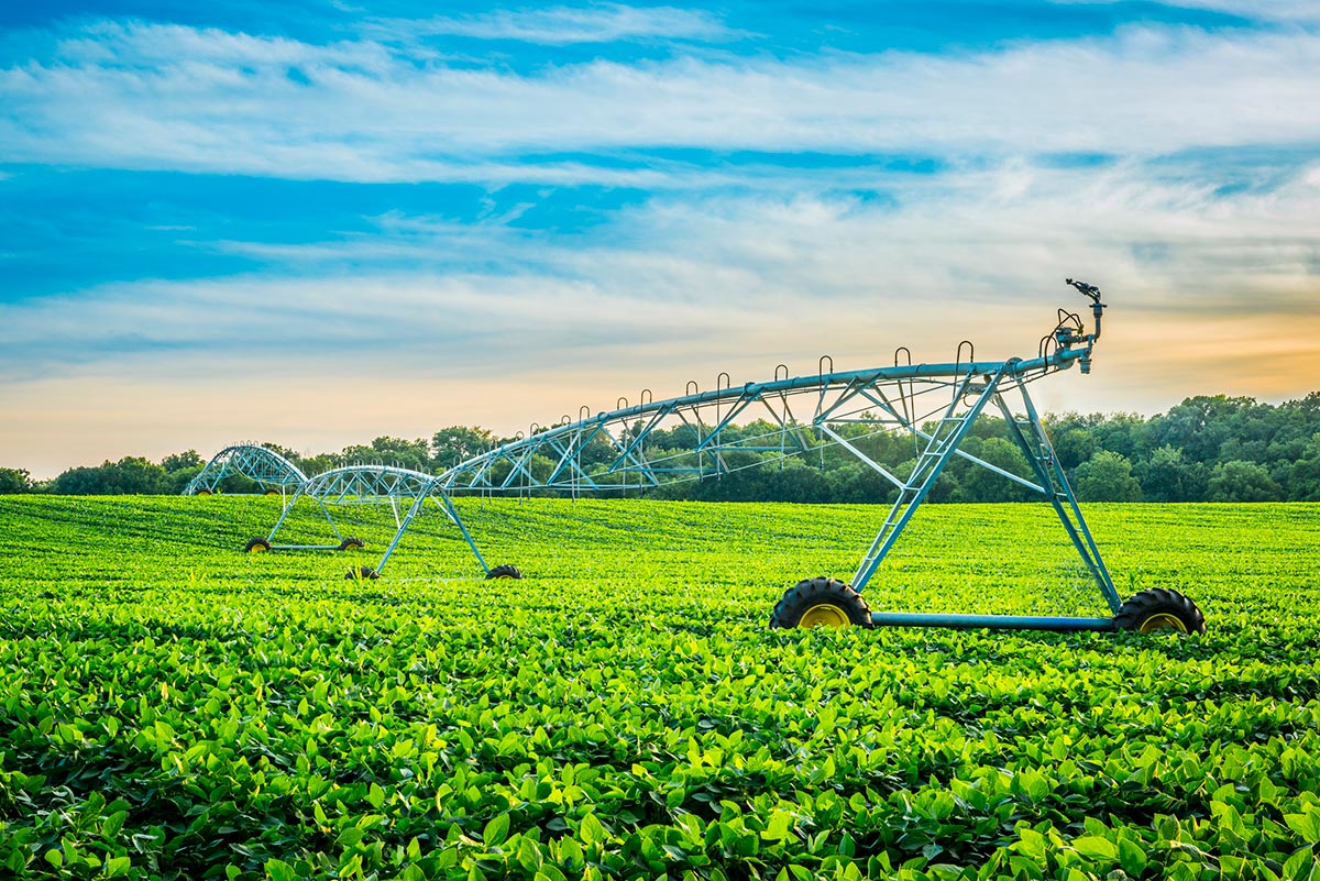 Irrigation System at Sunset with Cloudy Skies